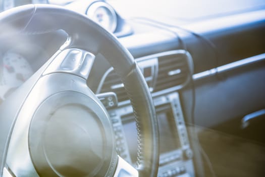 Steering wheel in interior of the sports car