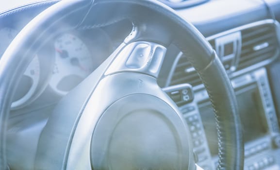 Steering wheel in interior of the sports car