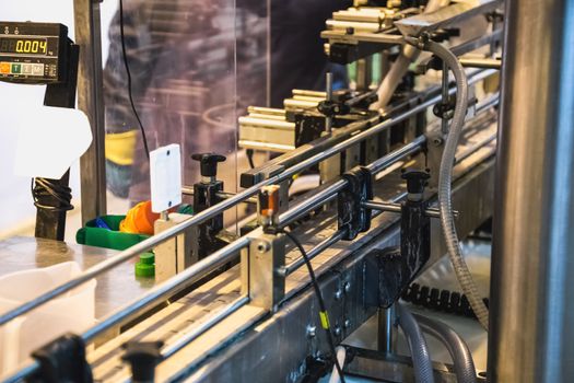 Automatic packing line of conveyor. Pharmaceutical and chemical industry. Manufacture on factory
