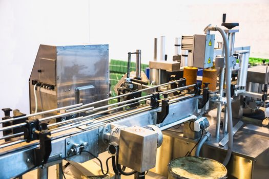 Automatic packing line of conveyor. Pharmaceutical and chemical industry. Manufacture on factory
