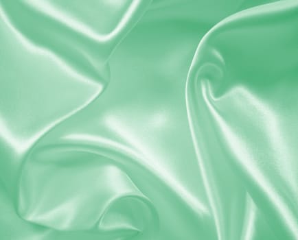 Smooth elegant green silk or satin texture can use as background 