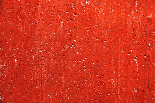 Grunge plaster cement or concrete wall texture red color with scratches