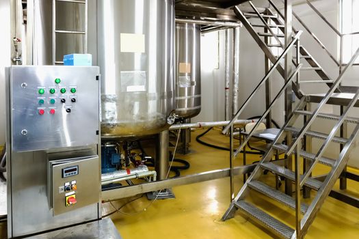 Water conditioning or distillation room with control panel equipment and water boiler or tank on pharmaceutical industry or chemical plant