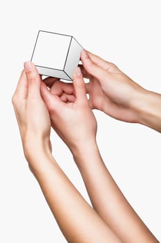 Hands holding white cube on white background