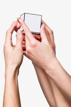 Hands holding white cube on white background