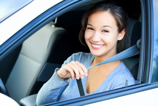 Always fasten your seatbelt. Girl in a car