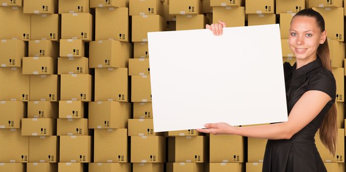 Smiling businesswoman with blank paper on ardboard boxes set background