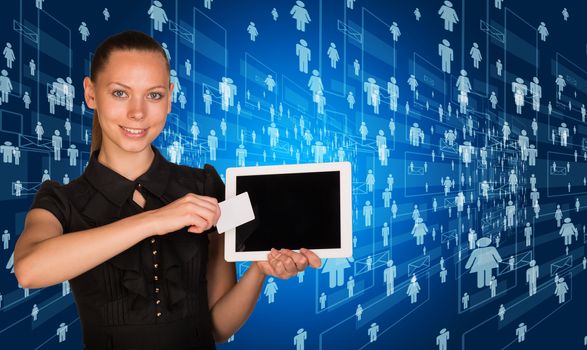 Smiling young woman holging tablet and blank card and looking at camera on abstract digital blue background with icons