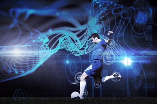 Football player kicking ball against abstract glowing black background