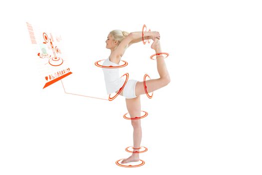 Sporty woman stretching body while balancing on one leg against fitness interface