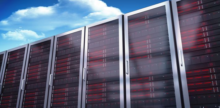 Server towers against bright blue sky with clouds