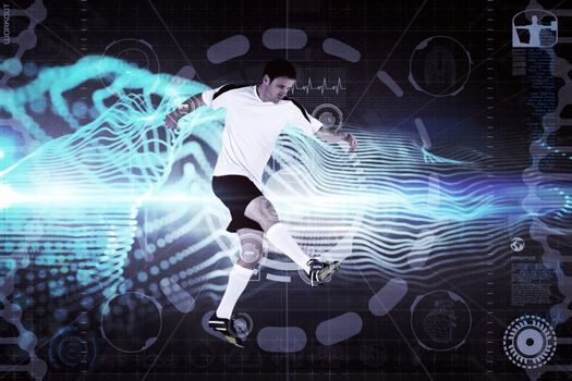 Football player in white kicking against abstract blue glowing black background