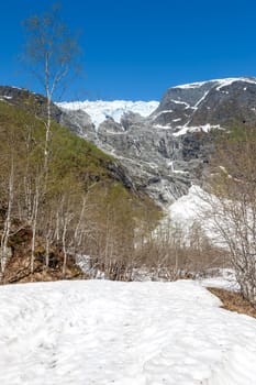 early spring in the mountains, Norway. snow and blue sky