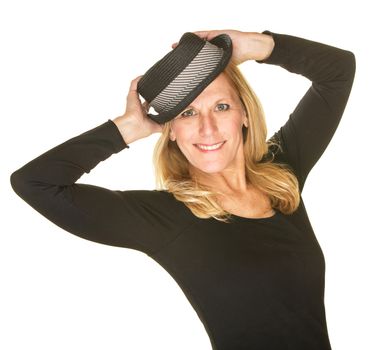 Beautiful blond woman dancing and holding hat