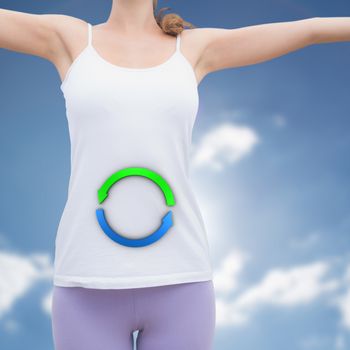 Woman standing with arms raised on countryside landscape against cloudy sky with sunshine