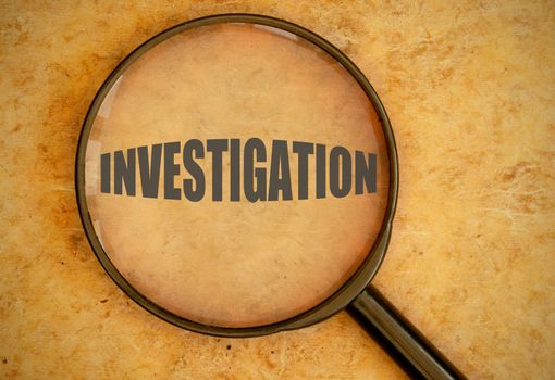 Magnifying glass focused on investigation