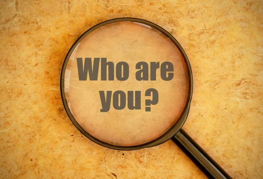 Magnifying glass focused on the question who are you