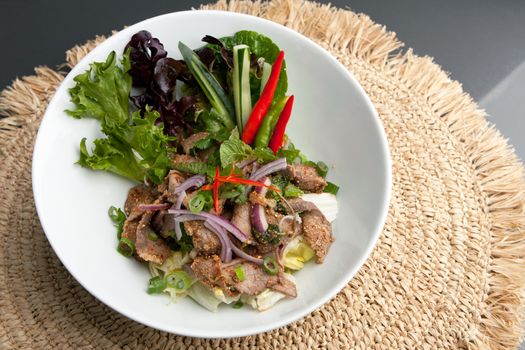 Asian style Thai salad with steak and fresh vegetables.