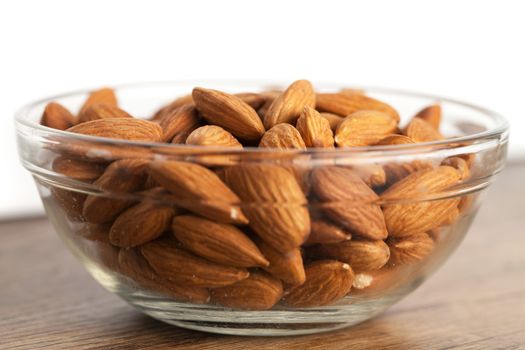 Organic almonds in raw form unroasted and unsalted.  Close up macro still life with a shallow depth of field.