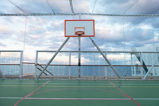 Basketball court and hoop with a view of the Atlantic ocean.