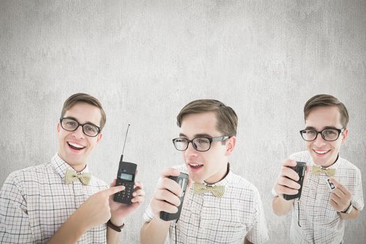 Nerd with tape recorder against white and grey background