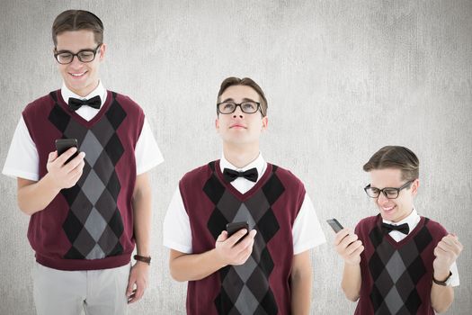 Nerd with smartphone against white and grey background