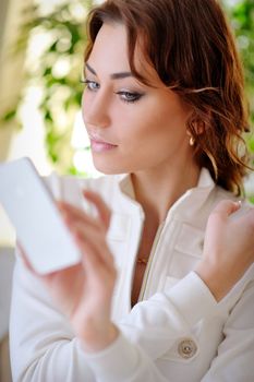 Portrait Of Smiling Beautiful Woman Talking On Mobile Phone.