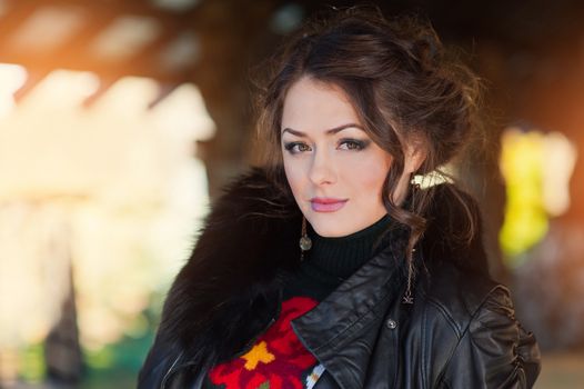 Portrait of a beautiful sexy brunette on natural background.