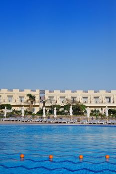 beautiful swimming pool in the Egyptian hotel with sunbeds.