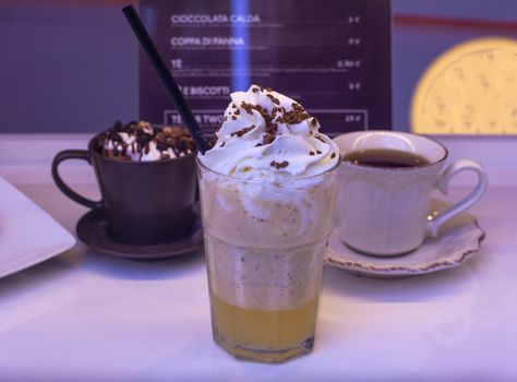 Close up of thickshake , chocolate cup and tea