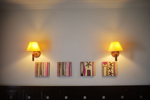two wall lamps included in the room.