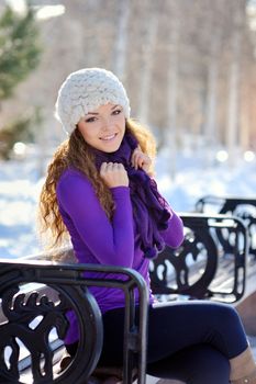 Beautiful brunette girl on a walk in winter.