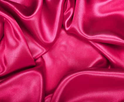 Smooth elegant pink silk or satin texture can use as background