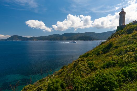 View of the bay and old fortress on a rock, Tuscany, Italy.