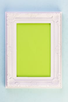 White Frame on blue background with green for your copy