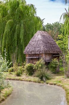 a small hut with a thatched roof. Africa