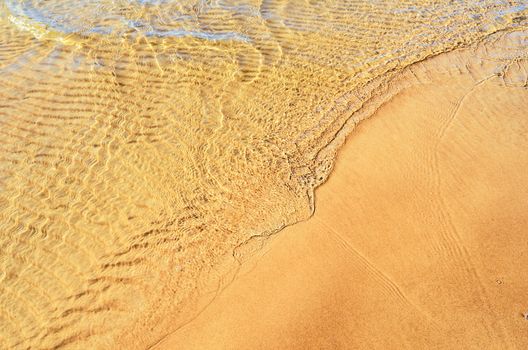 Soft wave on the sandy beach