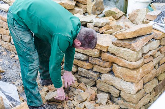 Sand stone wall for a raised bed. Create a dry stone wall.