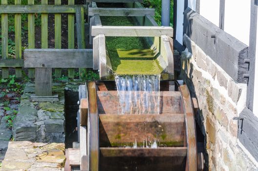 Wooden wheel for driving a historic water mill.