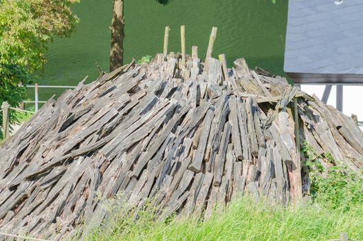 A built-up wood pile for the production of charcoal.