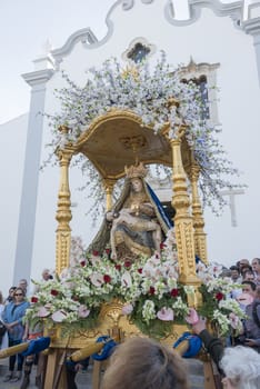 LOULE,PORTUGAL-APRIL19, 2015: man are bringing the 600 kg heavy statue of the Holy Maria to the church in Loule on April 19 2015,This proccesion called Festa da Mae Soberana is 14 days after easter
