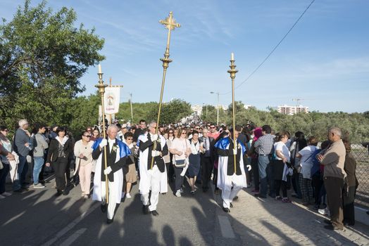 LOULE,PORTUGAL-APRIL19, 2015: man are bringing the 600 kg heavy statue of the Holy Maria to the church in Loule on April 19 2015,This proccesion called Festa da Mae Soberana is 14 days after easter