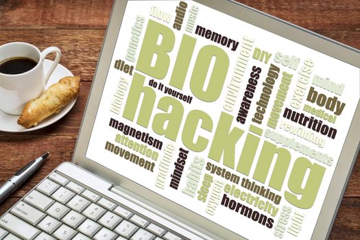 biohacking -  managing one's own biology using a combination of medical, nutritional and electronic techniques - word cloud on a digtal tablet