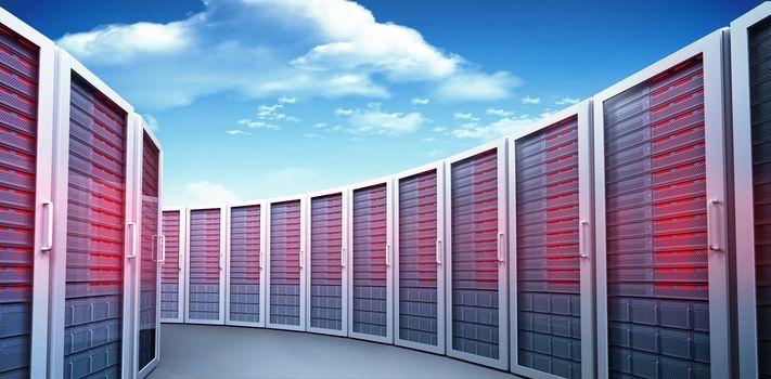 Server towers against bright blue sky with clouds