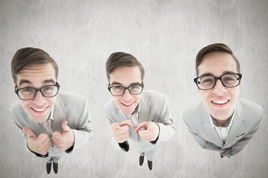 nerdy businessman showing thumbs up against white and grey background