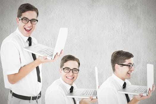 Nerd with laptop against white and grey background