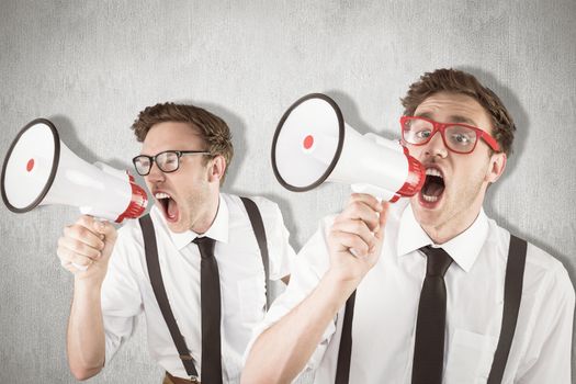 Nerd with megaphone against white and grey background