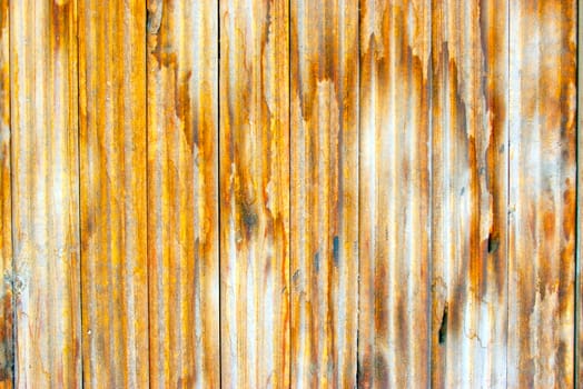 Dirty, stained by a paint the hammered together fence