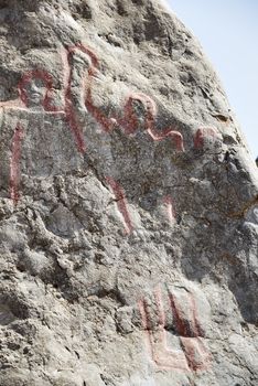 Closeup of the famous Colemans Rock in Oman with highlighted old pictures of people