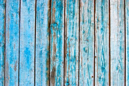 Dirty, stained by a paint the hammered together fence